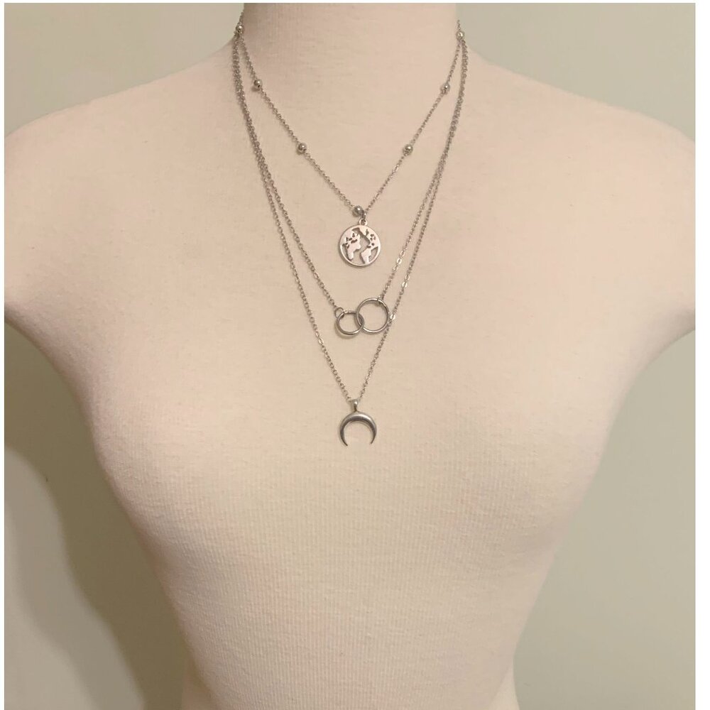 Elegant Layered Silver Necklace with Globe, Rings and Crescent Moon Charm